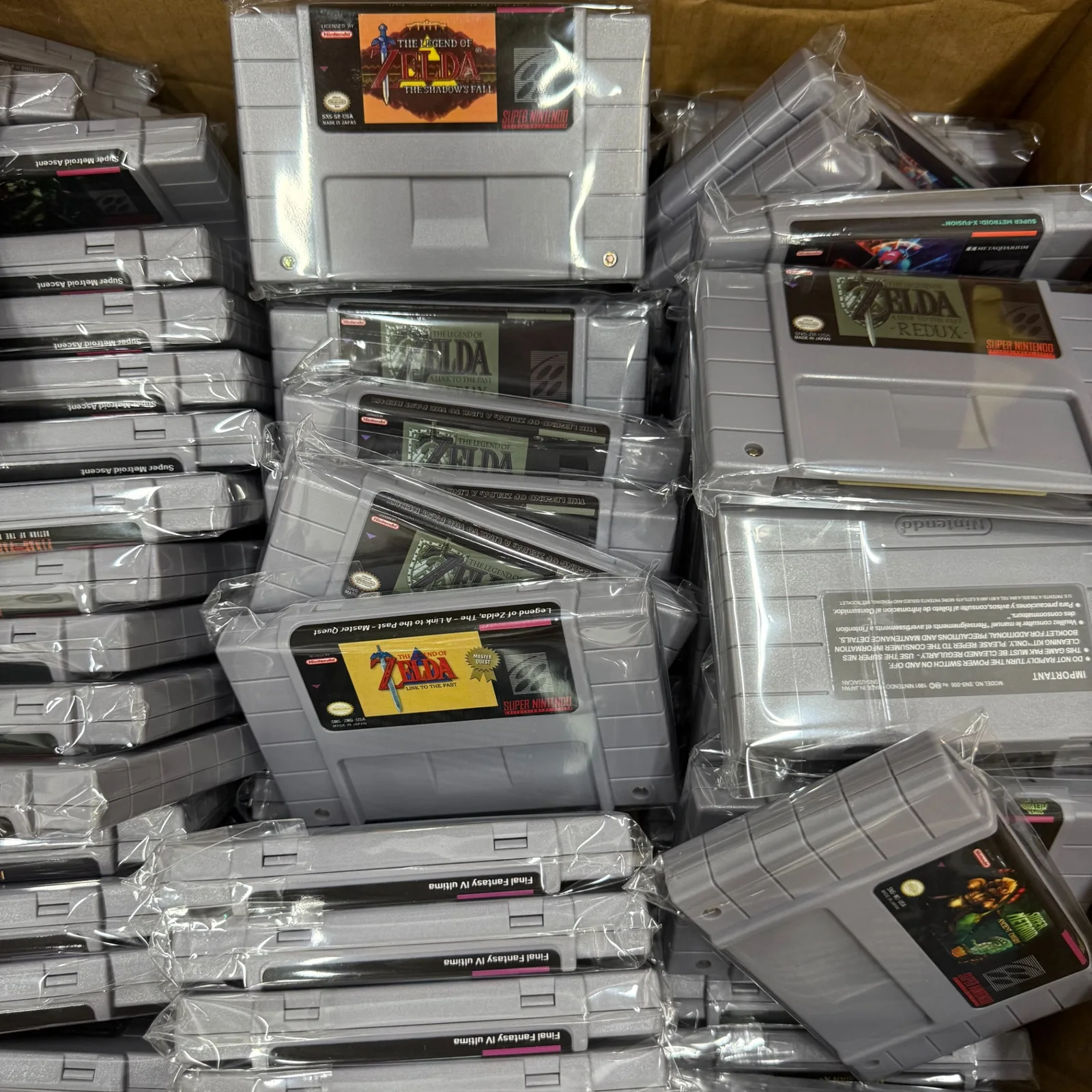 Original supplied source photo: batch of packaged SNES-format cartridge products